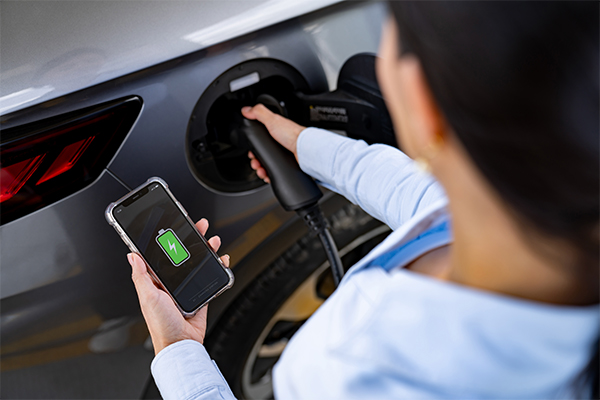 Person with Electric Vehicle Charging