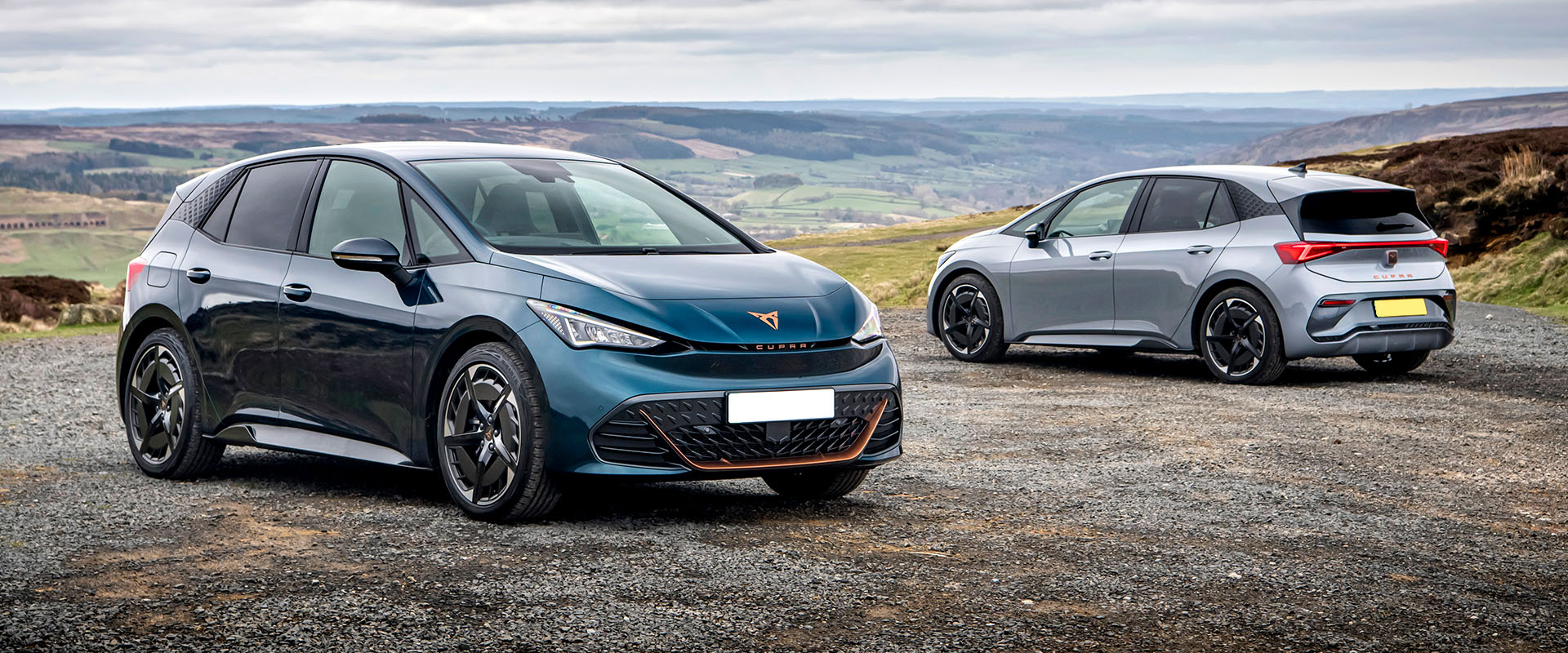Electric cars in scenic landscape